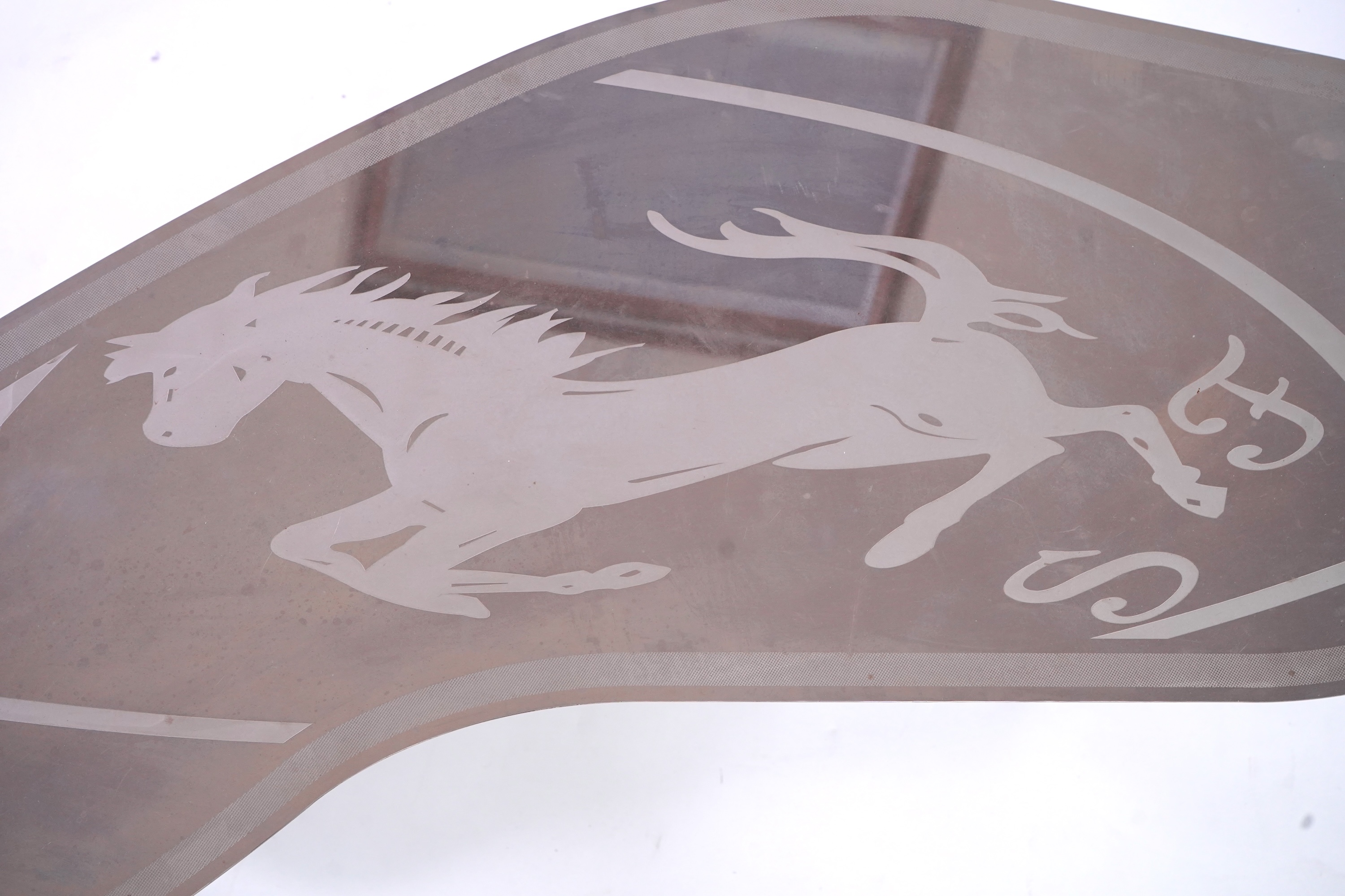 Pietro Psaier (Italian 1939-2004) A Ferrari polished steel coffee table, 1 of 3, in homage to Carlo Mollino